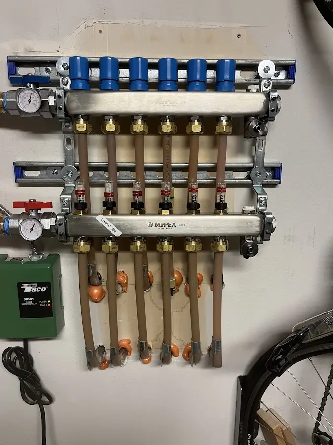 Plumber performing Water Heater Repair at a residential property in Bay City